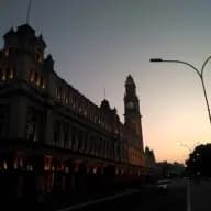 Architecture of Luz train station facing the sunset.